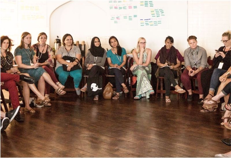 A group of people in a meeting