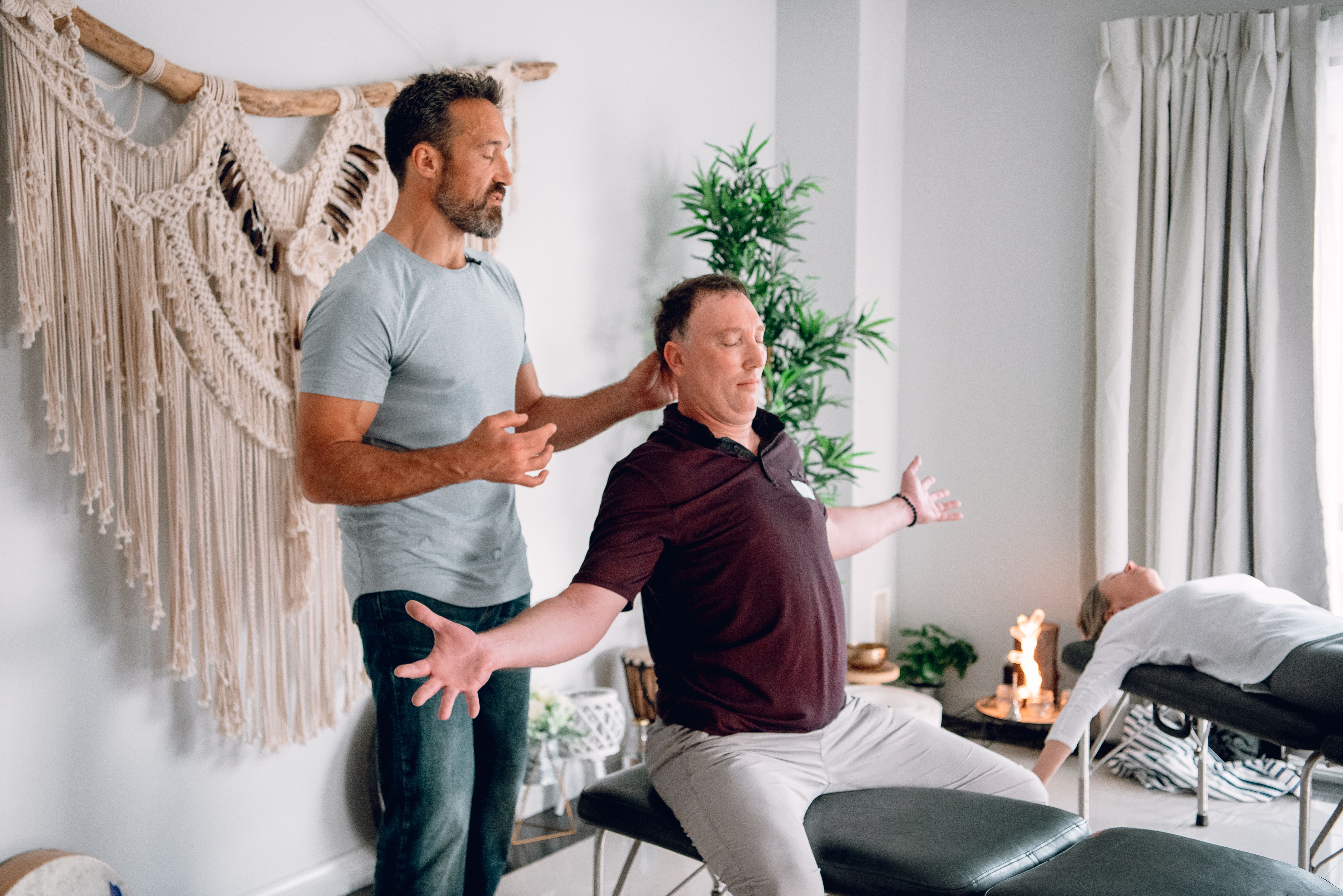 Dr John Surie in clinic with a client