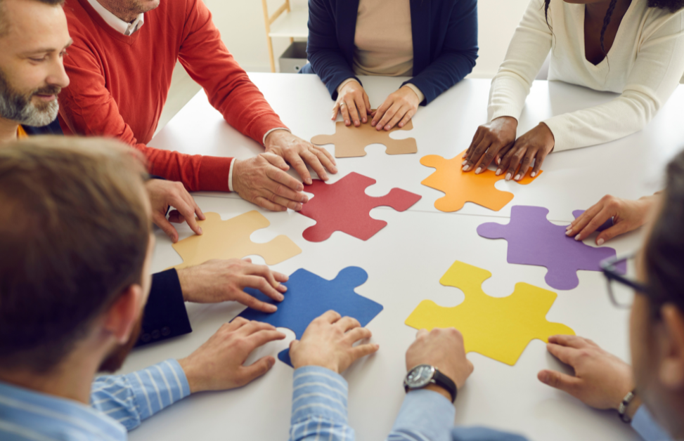 Business people with puzzle pieces