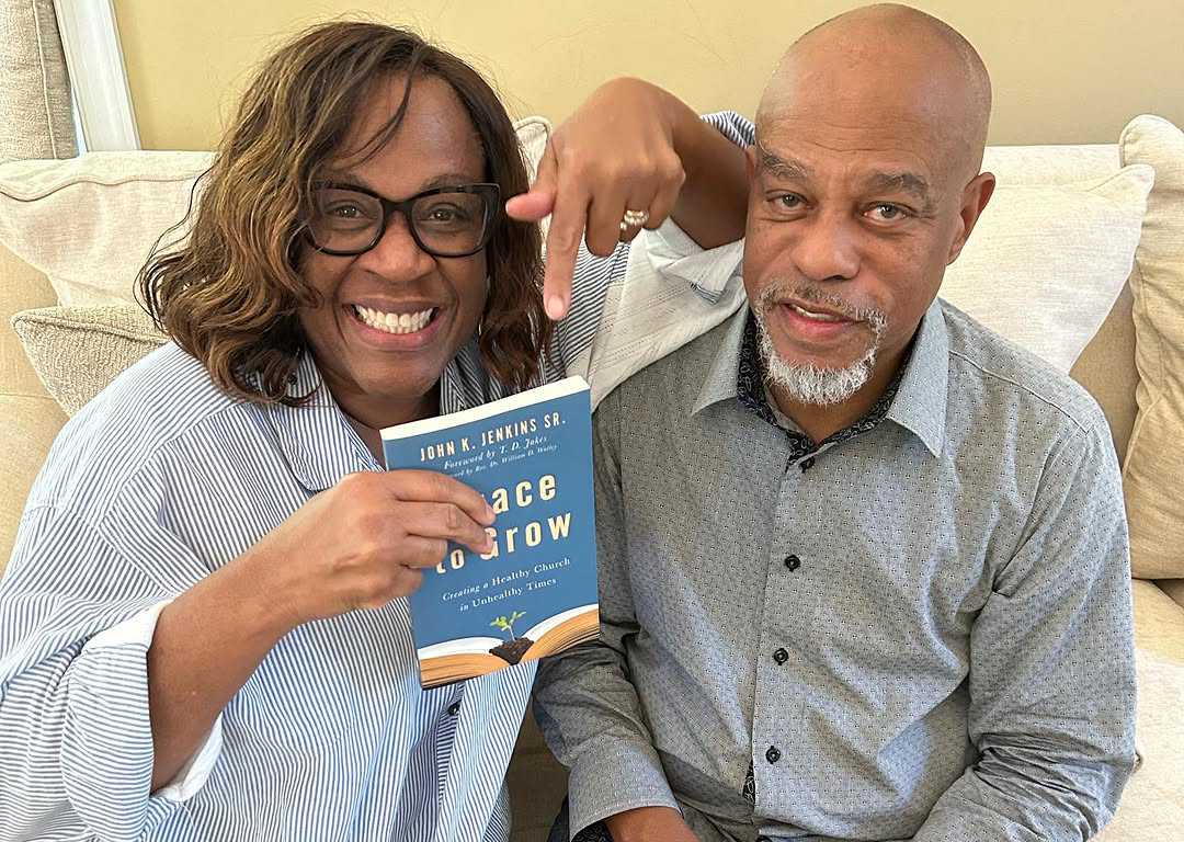 Pastor John K. Jenkins and Trina Jenkins holding his book Grace to Grow - CLICK HERE TO PURCHASE BOOK