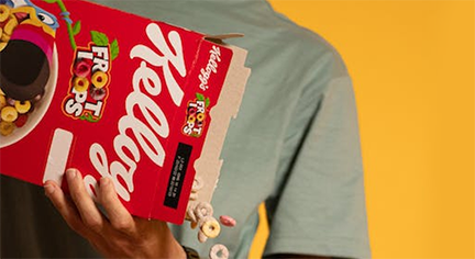 A box of Froot Loops cereals being poured in a bowl