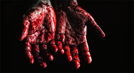 A bloody hands in a dark background