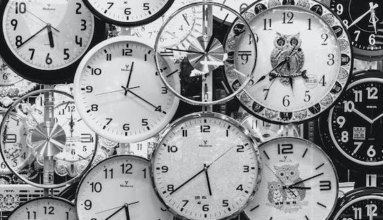 A bunch of black and white watches in one image
