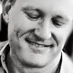 James Gallaway - A black and white smiling portrait of James Gallaway