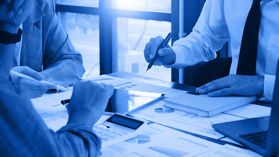 Three people on a meeting while discussing some business related topics