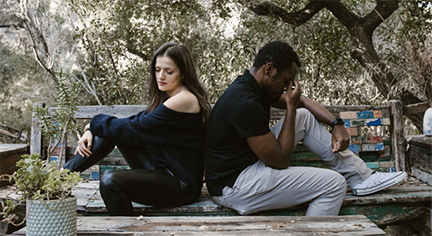 A couple breaking up in the park