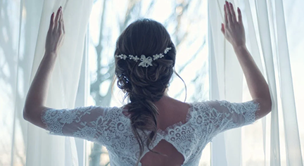 A bride looking at the window