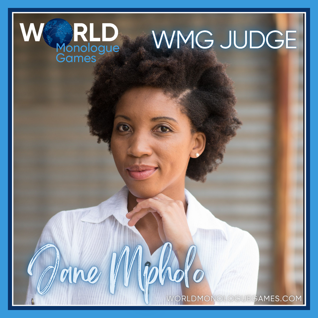 Jane Mpholo, a curly haired woman wearing a white blouse posing infront of a camera