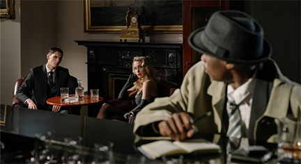 A man and a woman being investigated by surveillance officer