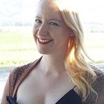 Sally Williams - Blonde woman smiling while looking in the camera