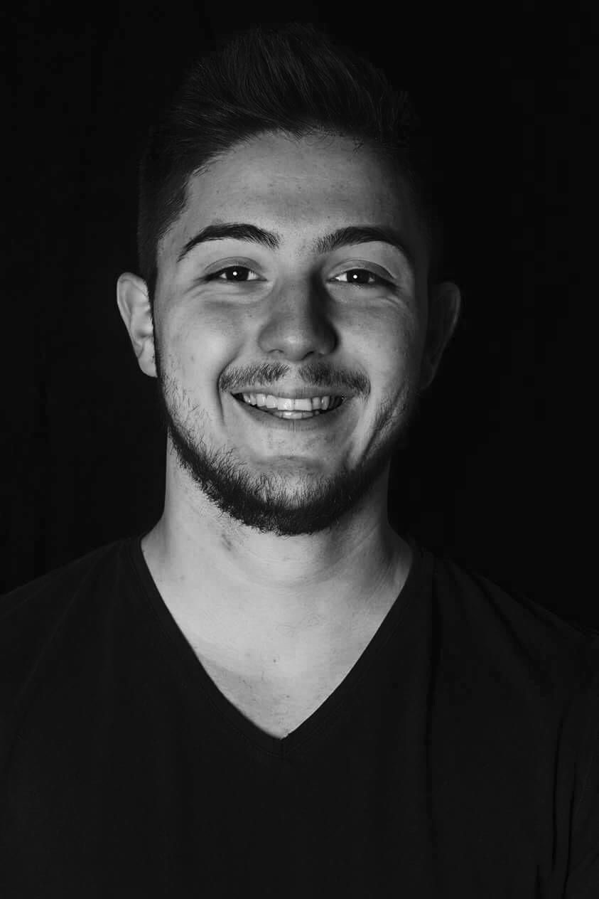 Mike Savuica, A short haired guy with a full facial beard wearing a black shirt