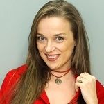 Mirela Buhus, A long haired blonde girl wearing a red dress and necklace