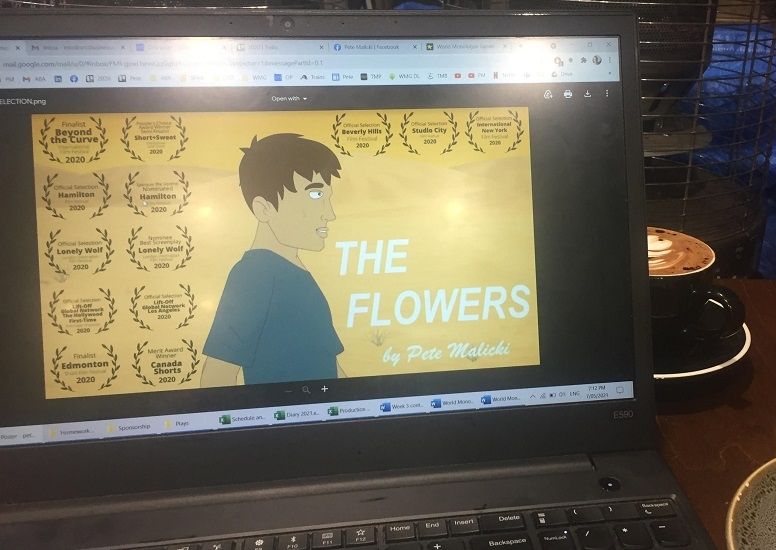 A laptop featuring Pete Malicki's film entitled "The Flowers"