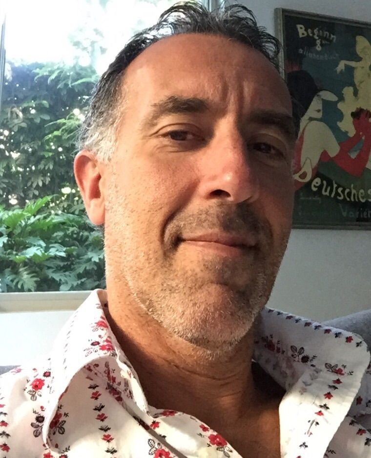 Josh Galitsky - A middle aged man wearing a texture polo