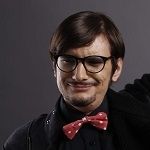 Mihnea Zamfirescu, A man wearing glasses and a bow tie, exuding a sophisticated and stylish demeanor.