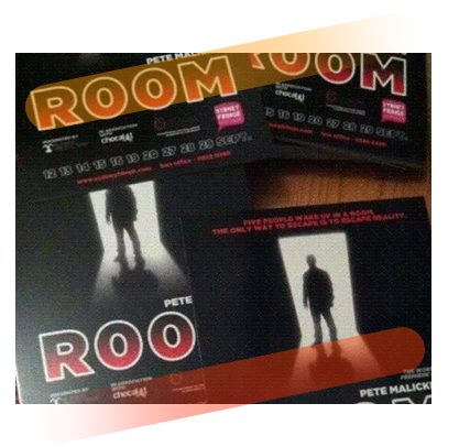 A silhouette of male standing infront of a door