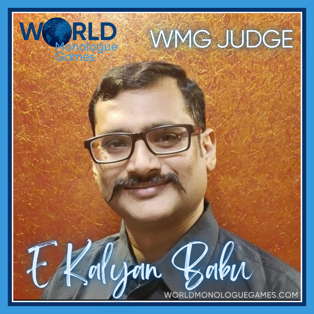 E Kalyan Babu - A short haired Indian with a mustache wearing a glasses and a dark gray colored formal sleeves