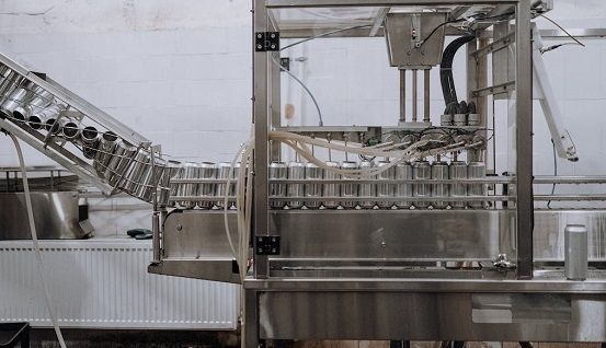 A machine producing tin cans