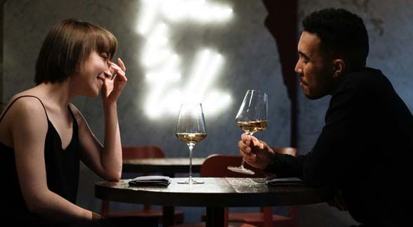 A couple on a date while having a glass of wine