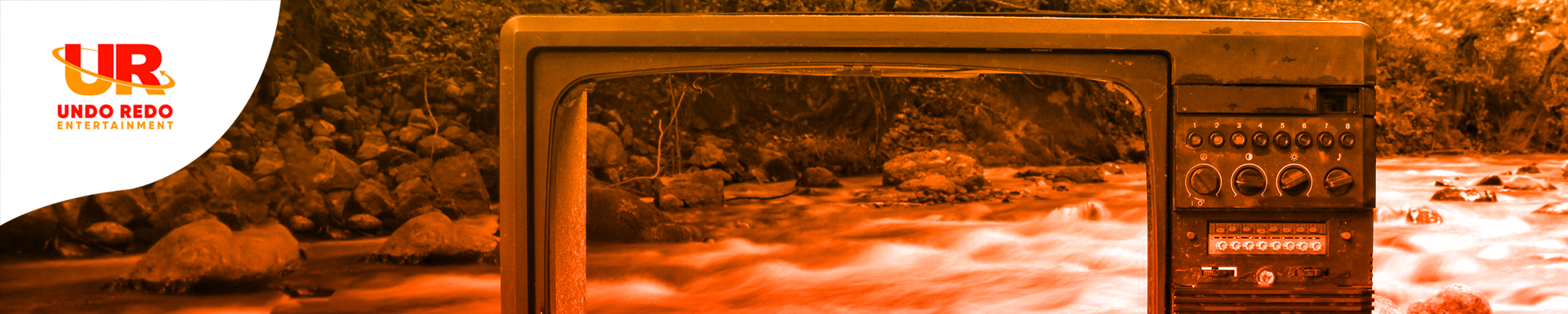 Old Television in the middle of a lake with organge and red gradient