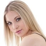 Nicole Torode - A blonde girl with a beautiful hair, pink lips and looking fierce infront of camera