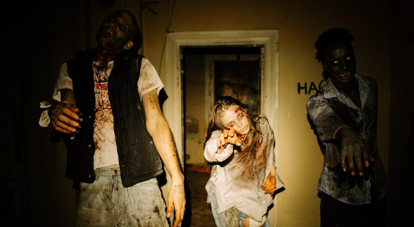 Two male zombie and a female zombie in the middle walking forward