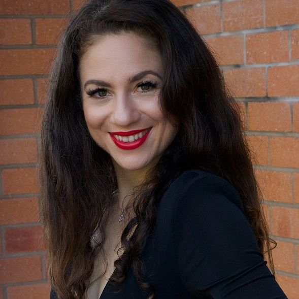 Marinna Psaltis, A smiling beautiful long haired lady wearing a black dress 