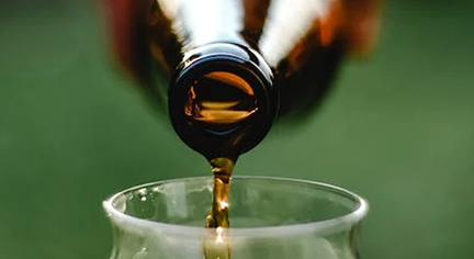 Pouring a bottle of beer in a glass