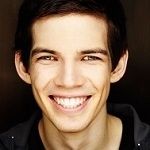 Atlas Adams - a smiling white guy with brown hair