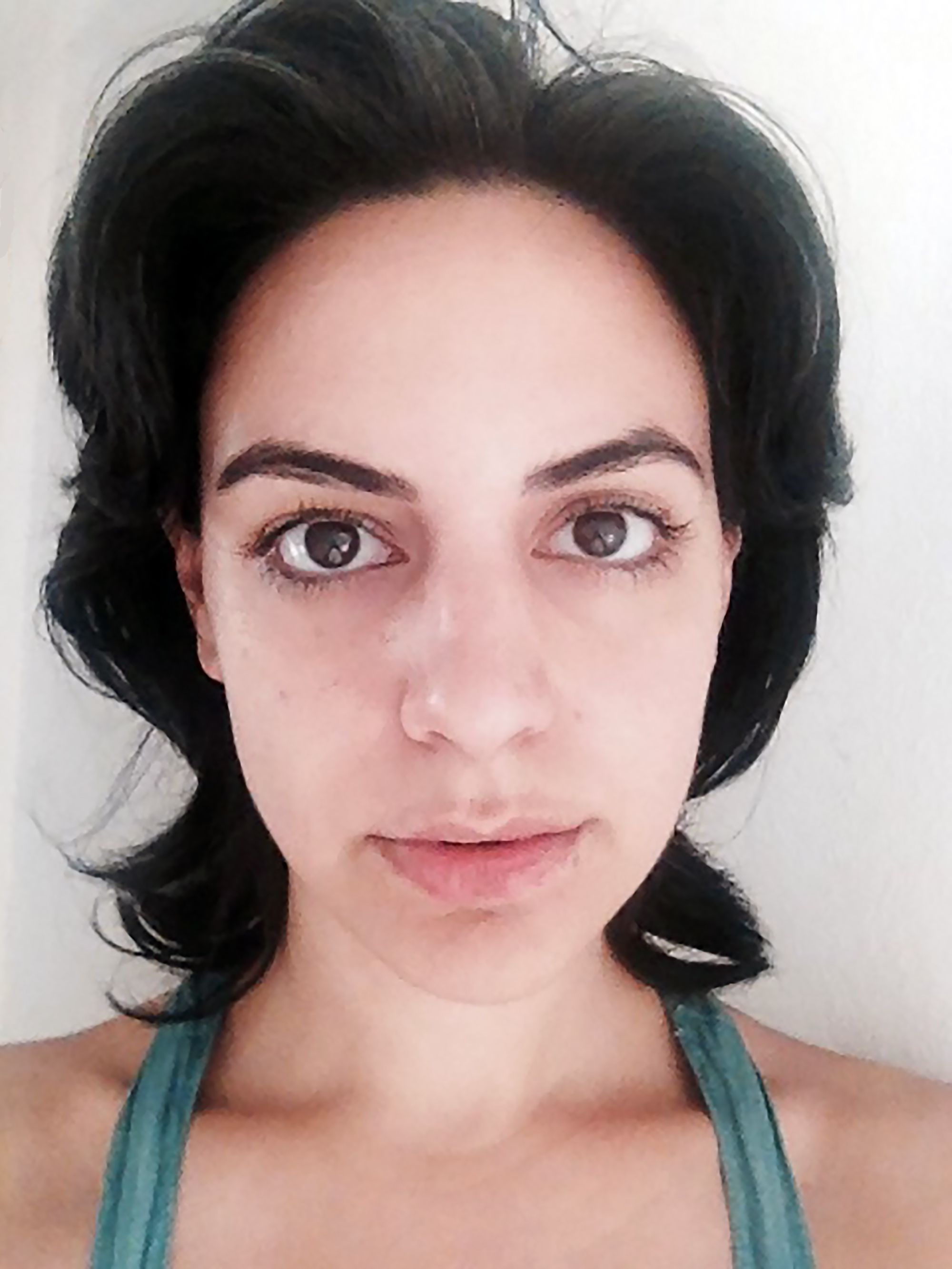 Duru Yücel-Țofei - A woman with dark hair wearing a blue top.