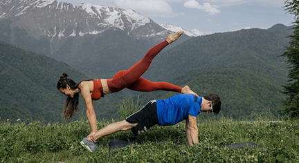 Two fitness experts doing a stunt