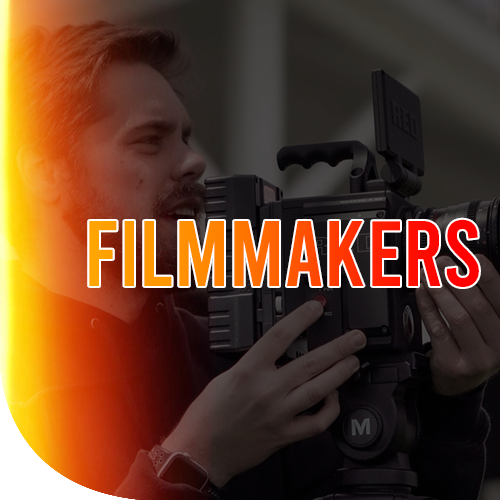 A male holding a filming camera