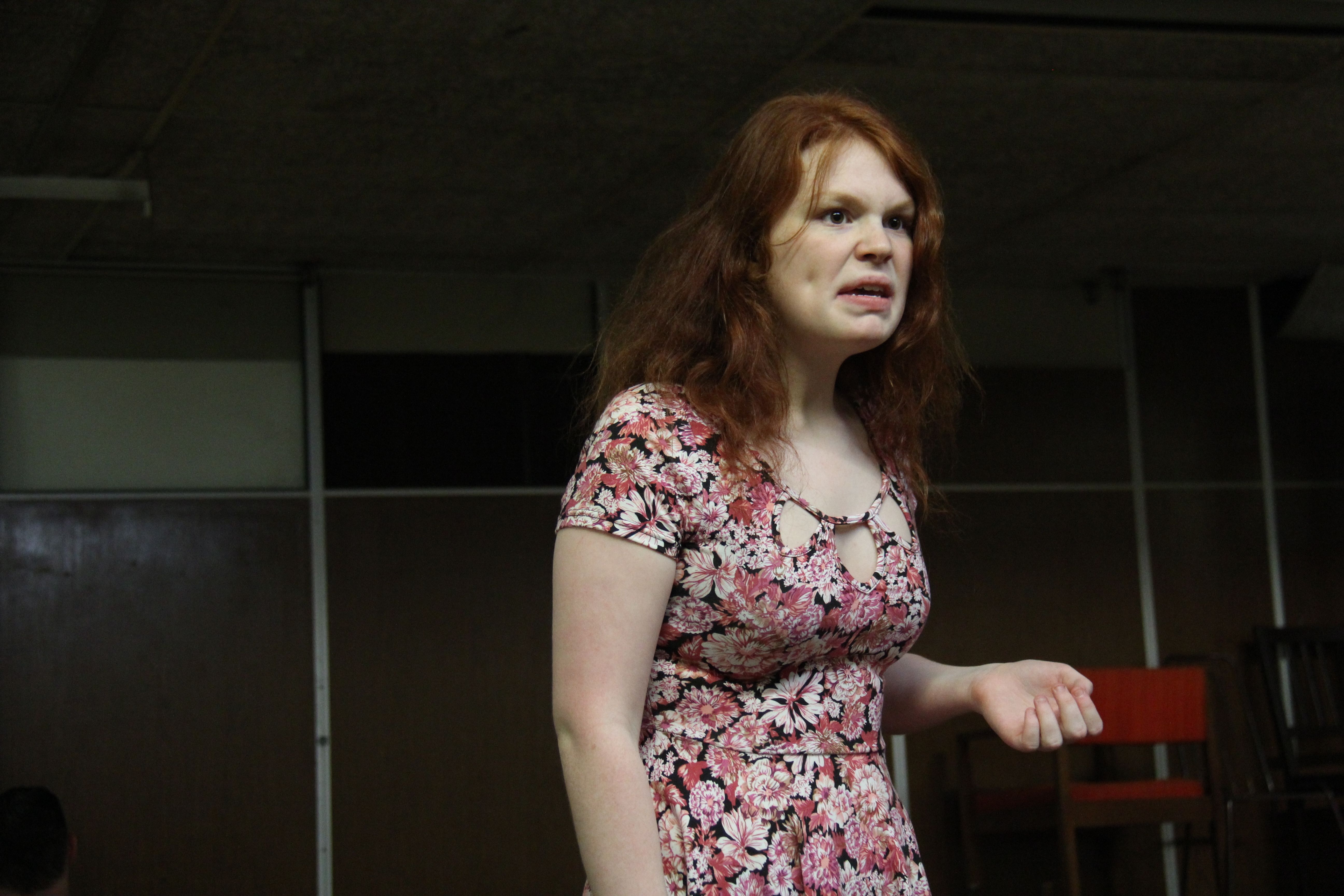 Ginger Female acting and wearing a floral dress