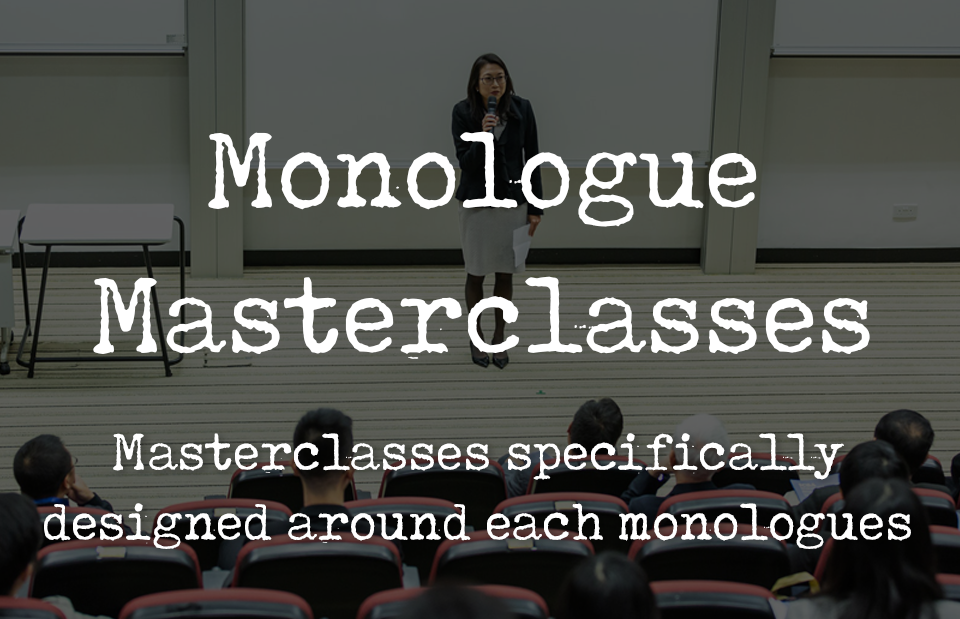 A teacher infront of a class discussing a lesson