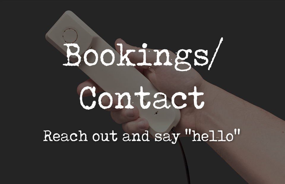 A hand holding an old telephone