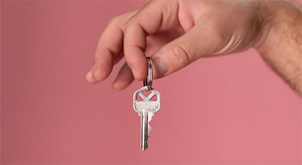 A hand holding a Key