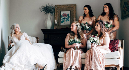 A bride and her four friends staring at each other