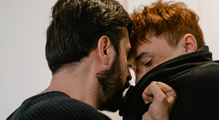 Two guys violently fighting each other