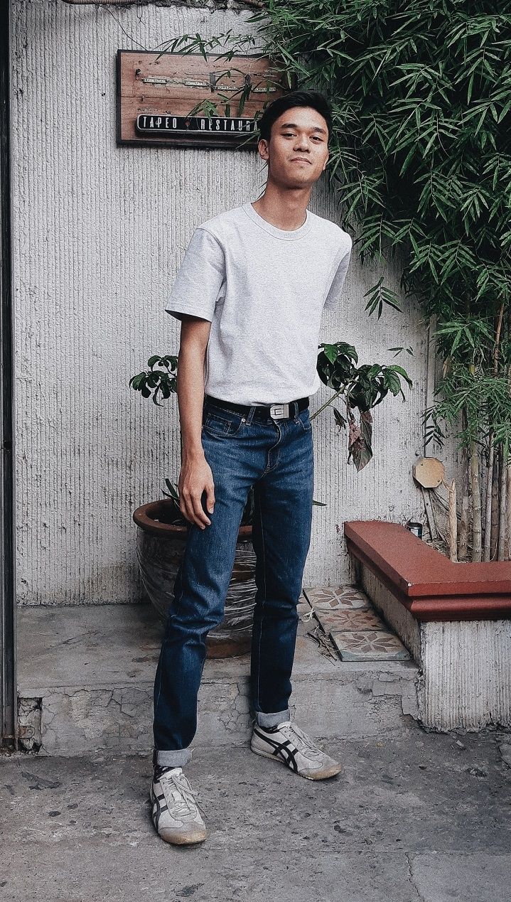 Nuel Rivera - A Filipino wearing a white shirt and a denim jeans with white sneakers on