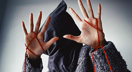 A kidnapped woman with a black cloth covered in her face