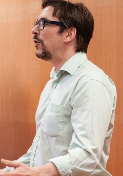 Nick Field - A middle aged guy wearing a long sleeves polo and a glasses