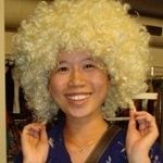 Thao Thanh Cao - An asian girl wearing a white afro curly wig