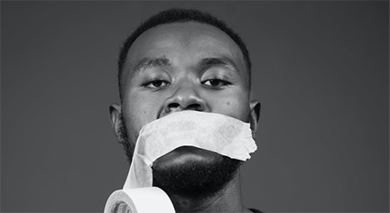 A black guy with a tape on his mouth