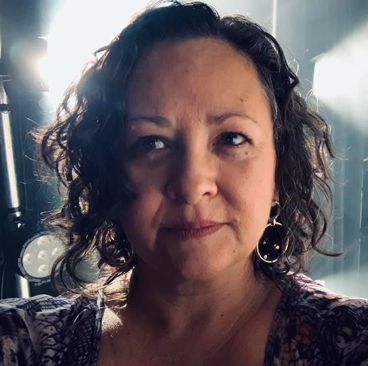 Danielle Brame Whiting, A short haired woman wearing a texture purple shirt