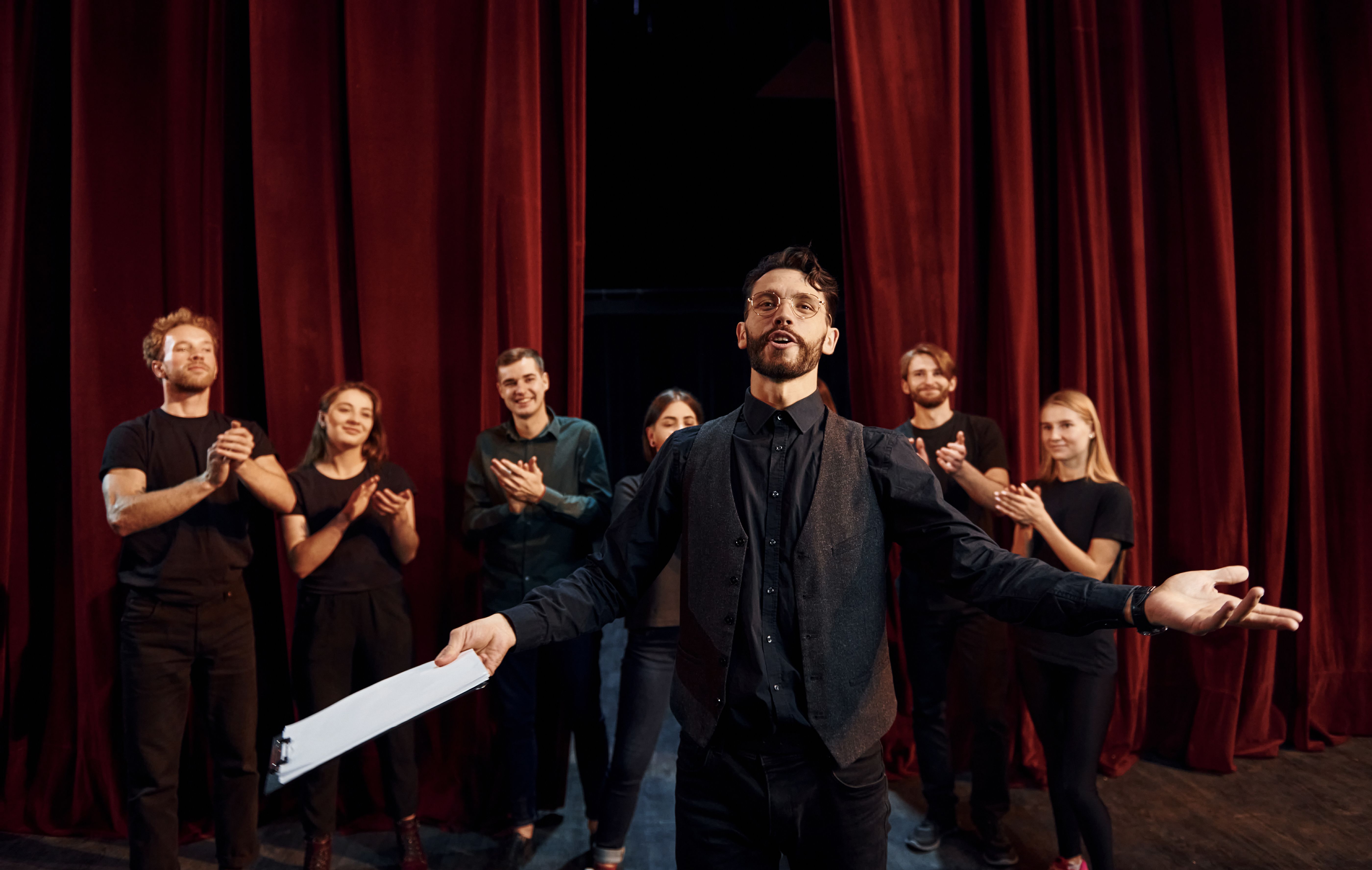Playful actors in costume playing in a park playground