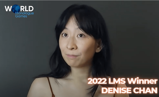 Denise Chan - black haired woman smiling in front of camera with a gray background