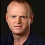 Glenn Groves - A fierce looking guy with brown hair, wearing a black shirt