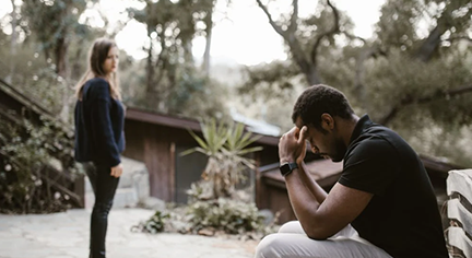 A couple breaking up in the park