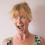 Portrait of Louise Wildman with open mouth wearing a floral shirt on a white background