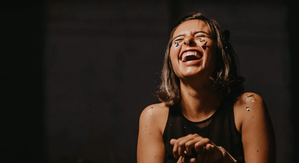 A very happy woman with face paint